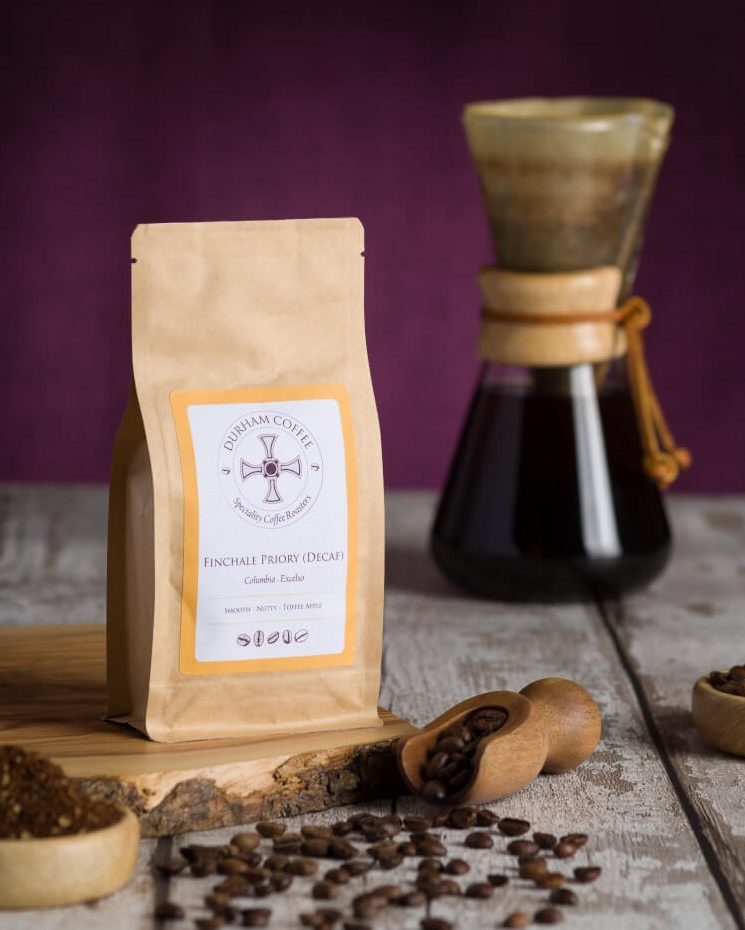 Finchale Priory Decaf coffee bag, coffee beans and a chemex